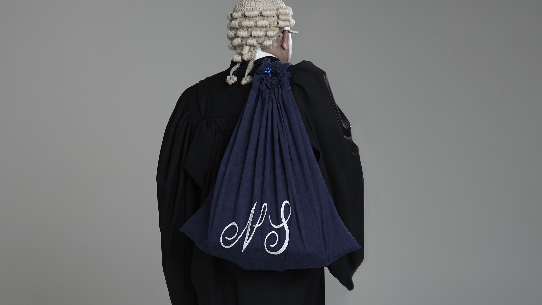 Dr Nav Sedaghati in barrister attire, used as a restrained advocacy heritage image